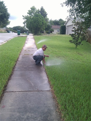 a Stafford sprinkler repair tech is checking the current system