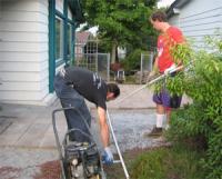 two Missouri City irrigation repair techs are installing a new system