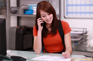 Lisa is on the phone scheduling a drip line installation